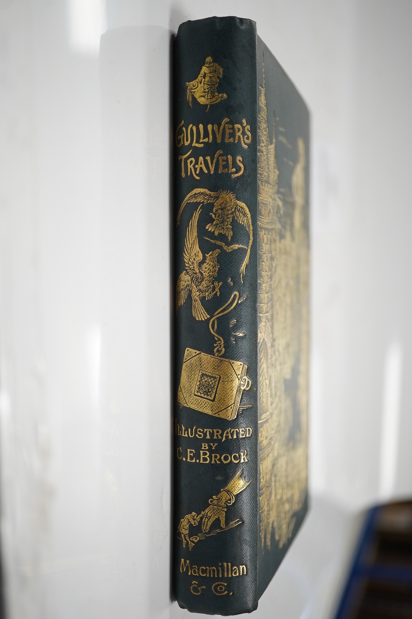 [Swift, Jonathan] Travels into Several Remote Nations of the World. By Lemuel Gulliver ... one hundred illustrations by Charles E. Brock. frontis and engraved illus. (some full page); original gilt pictorial cloth and ge